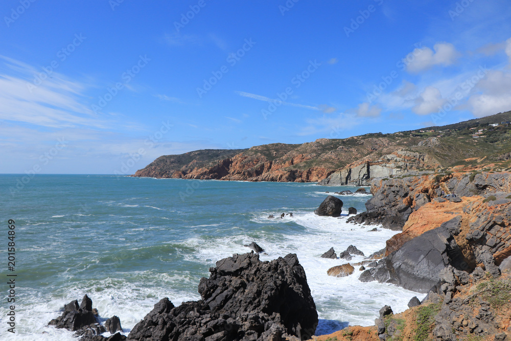 Portuguese coastline with the ocean and the sintra mountains in background. Cascais Portugal