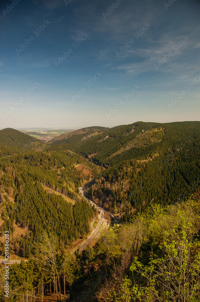 Panorama valley view from a mountain top cliffs in spring with blue sky. Ahrendsberger Klippen, Okertal, Okertalsperre, Oker (Goslar) National Park Harz 