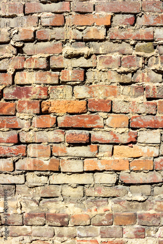 Vertical background of old vintage red brick wall