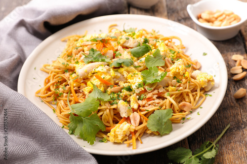 fried noodles with egg, vegetable and almond