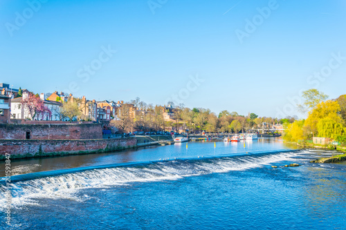 Fotografi View of residential houses alongside river Dee in Chester, England