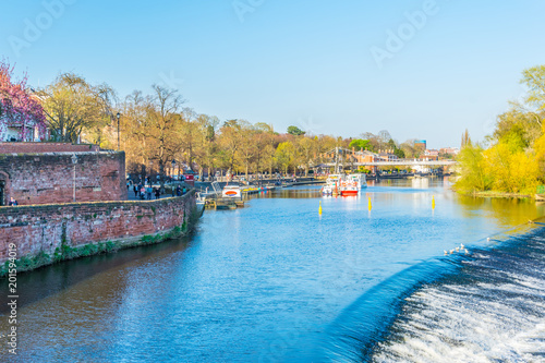 View of residential houses alongside river Dee in Chester, England photo