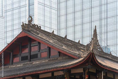 Daci buddhist temple against modern building in Chengdu, China