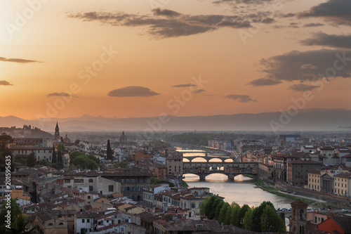 Florence cityscape with Arno river and Ponte vecchio at sunset - Tuscany, Italy 