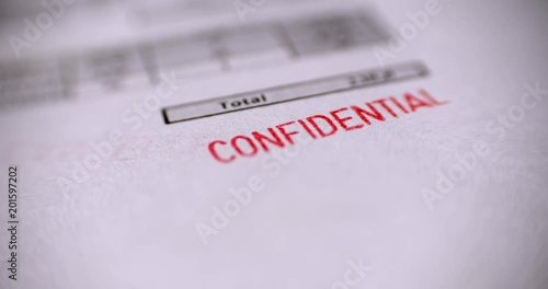 'CONFIDENTIAL' Red Stamp over a white background. photo