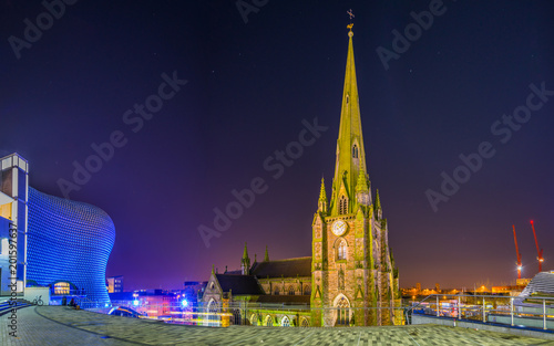 Night view of Saint Martin church surrounded with Bullring shopping mall in Birmingham, England photo