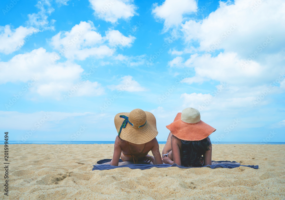 Two lady sleep and relax on the beach in Thailand,And Holiday concept Two lady sleep and relax on the beach in Thailand,And Holiday concept