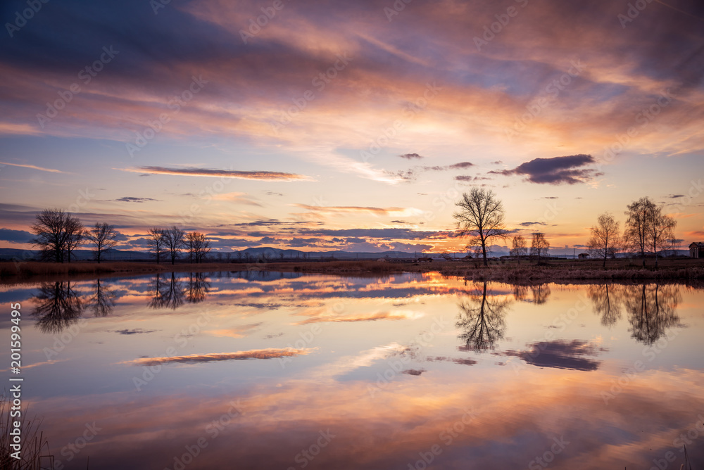 Sunset over lake and beautiful clouds. Sunset over lake and beautiful clouds.