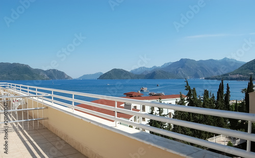 View of the blue sea and mountains from the balcony of hotel.