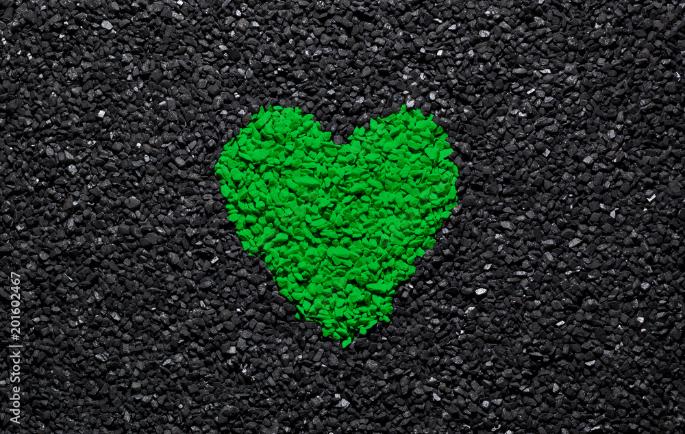 Green heart on the black background, stones, gravel and shingle, wallpaper, valentine Green heart on the black background, stones, gravel and shingle, wallpaper, valentine
