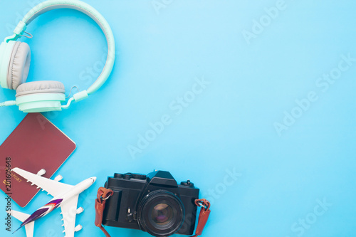 Creative Flat Lay Travel Concept With Headphones Passport Air Plane Model And Camera On Blue Color Background With Copy Space Stock Photo Adobe Stock