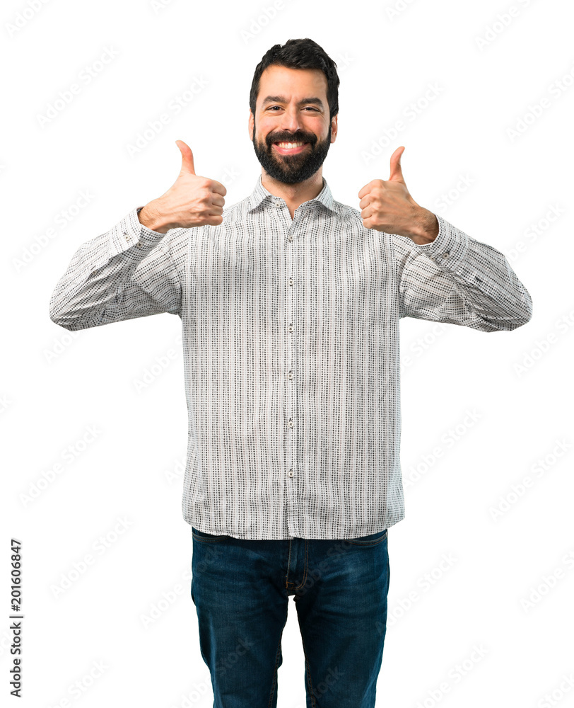 Handsome man with beard giving a thumbs up gesture and smiling Handsome man with beard giving a thumbs up gesture and smiling