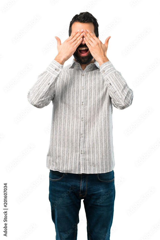 Handsome man with beard covering eyes by hands Handsome man with beard covering eyes by hands