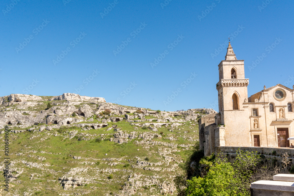 Horizontal View of the Church of San Pietro Caveoso, in the Sassi of Matera on Blue Sky Background. Matera, South of Italy