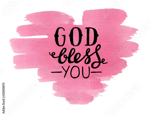 Hand lettering God bless you, made on pink watercolor heart.