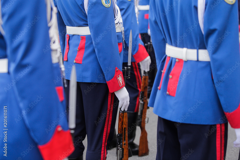 Parade soldiers wait with their guns on the ground for an event to start Parade soldiers wait with their guns on the ground for an event to start