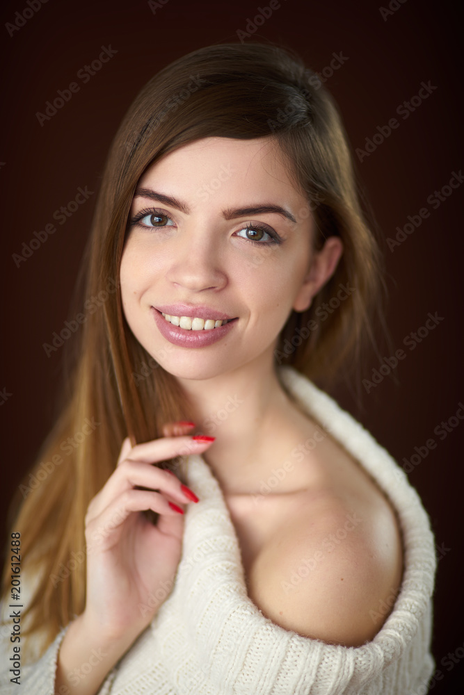 Concept: professional fashion lifestyle. Beautiful model posing in studio during classic test shooting wearing white sweater and white lingerie. Woman show poses and emotions. Portrait smiling Concept: professional fashion lifestyle. Beautiful model posing in studio during classic test shooting wearing white sweater and white lingerie. Woman show poses and emotions. Portrait smiling