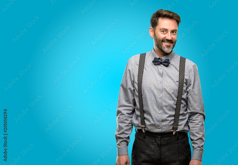 Middle age man, with beard and bow tie confident and happy with a big natural smile looking side Middle age man, with beard and bow tie confident and happy with a big natural smile looking side