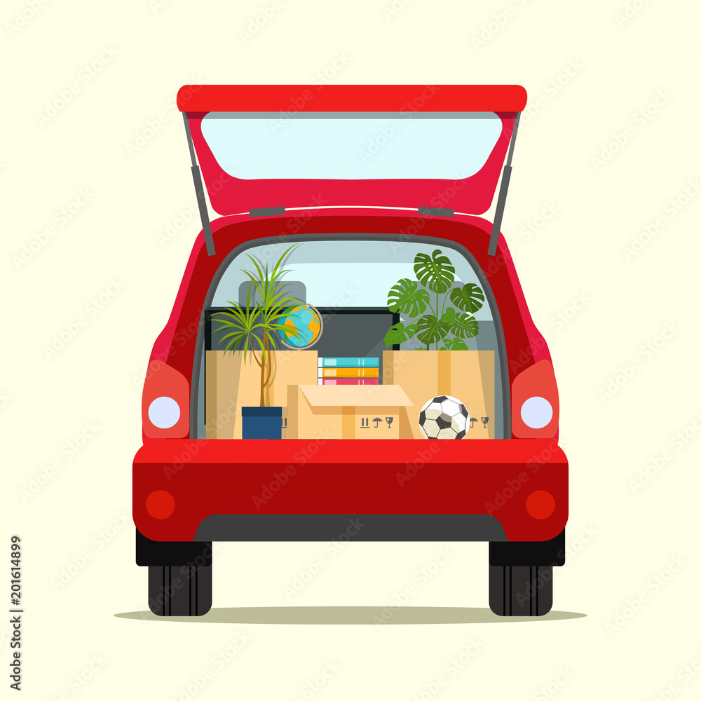 Moving with boxes. Things in box in the trunk of the car on the back