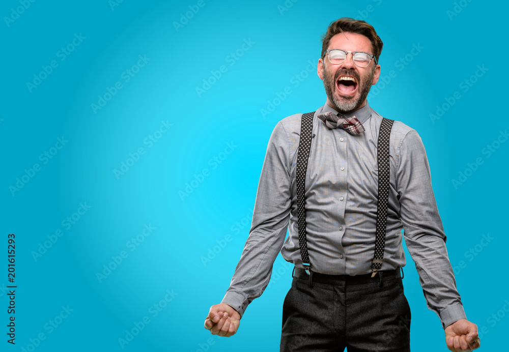 Middle age man, with beard and bow tie stressful, terrified in panic, shouting exasperated and frustrated. Unpleasant gesture. Annoying work drives me crazy Middle age man, with beard and bow tie stressful, terrified in panic, shouting exasperated and frustrated. Unpleasant gesture. Annoying work drives me crazy