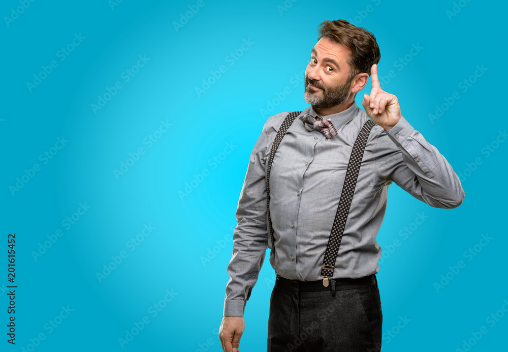 Middle age man, with beard and bow tie raising finger, is the number one Middle age man, with beard and bow tie raising finger, is the number one