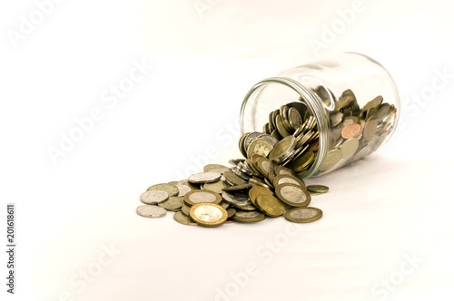 coin money in glass jar, white background in different positions