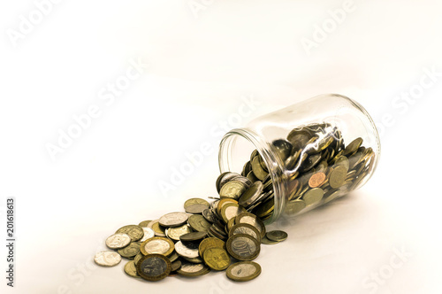 coin money in glass jar, white background in different positions