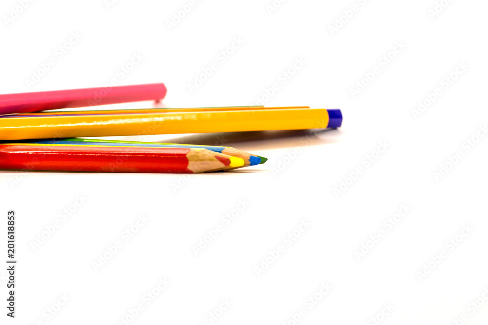 colored pencils lying on white background colored pencils lying on white background