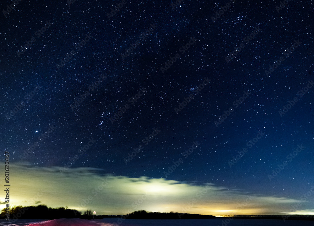 Starry sky above the bright clouds.