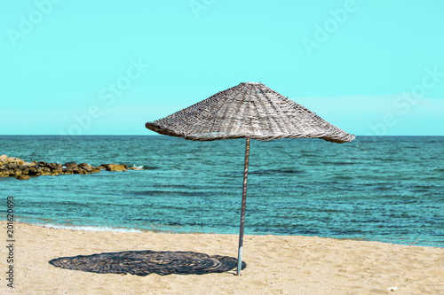Straw umbrella near the sea