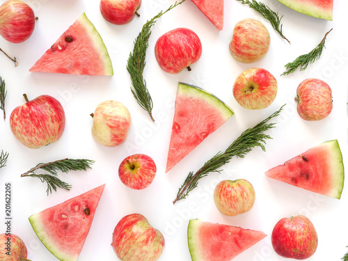 Fototapeta Naklejka Na Ścianę i Meble -  Pattern of watermelon lobules. Fresh watermelon sliced and apples on a white background.