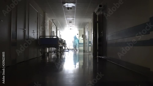 Dark Long Hallway with the Beds in the Hospital