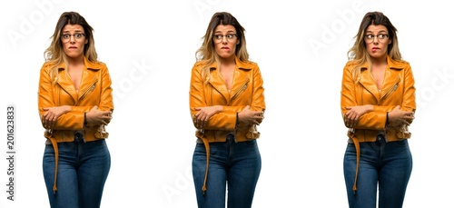 Beautiful young woman nervous and scared biting lips looking camera with impatient expression, pensive over white background