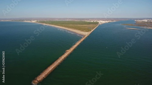 Aerial. Breakwater on the river Guadiana, the city Vila Real Santo Antonio photo