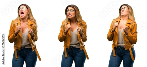 Beautiful young woman happy and excited celebrating victory expressing big success  power  energy and positive emotions. Celebrates new job joyful over white background