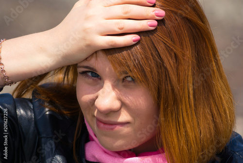 Portrait of pretty young redhair girl outdoor