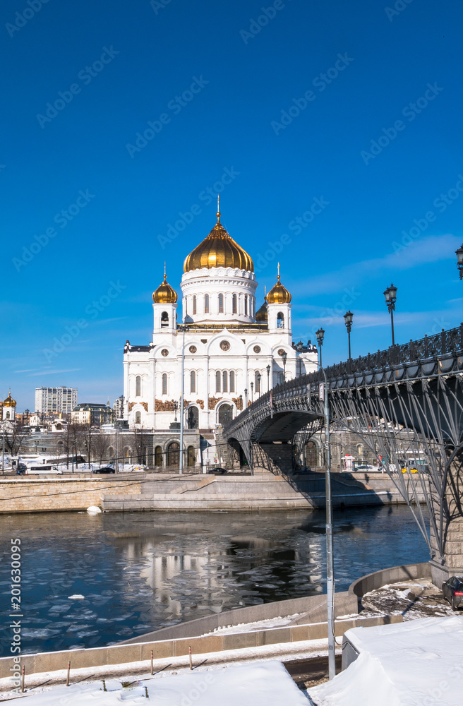 The new building of Russian Orthodox Cathedral of Christ the Saviour and the Patriarchy bridge over the Moscow River in Moscow.
