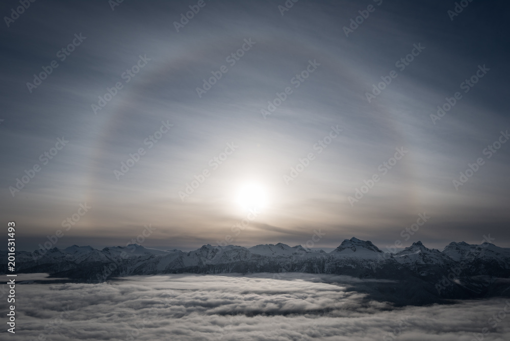 A Halo around the sun over top of Revelstoke mountain