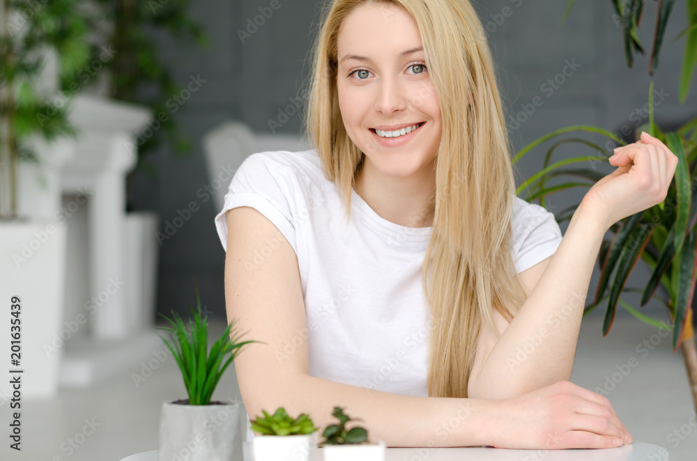 Beautiful Happy Woman In Home Interior. Attractive Happy Young Female With Blonde Hair, Healthy Smooth Soft Skin And Natural Facial Makeup. Skin Care. Beautiful Happy Woman In Home Interior. Attractive Happy Young Female With Blonde Hair, Healthy Smooth Soft Skin And Natural Facial Makeup. Skin Care.