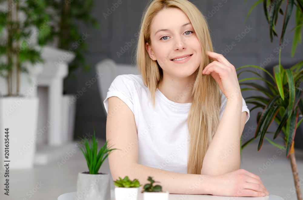 Beautiful Happy Woman In Home Interior. Attractive Happy Young Female With Blonde Hair, Healthy Smooth Soft Skin And Natural Facial Makeup. Skin Care. Beautiful Happy Woman In Home Interior. Attractive Happy Young Female With Blonde Hair, Healthy Smooth Soft Skin And Natural Facial Makeup. Skin Care.