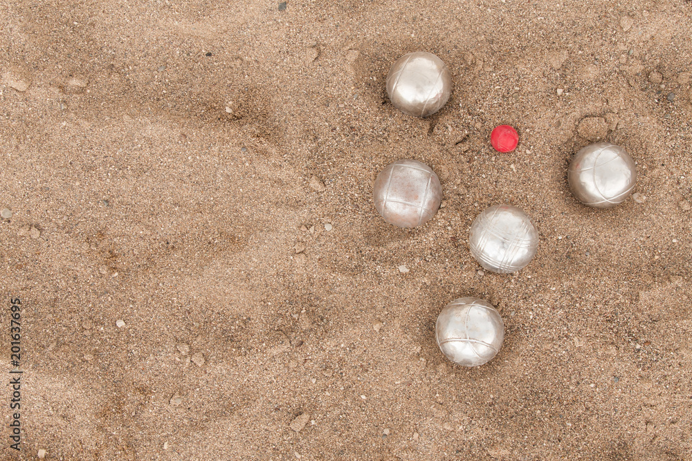 Beach. A game of Bocha. Brilliant silver balls for a bocha on the sand. Beach. A game of Bocha. Brilliant silver balls for a bocha on the sand.