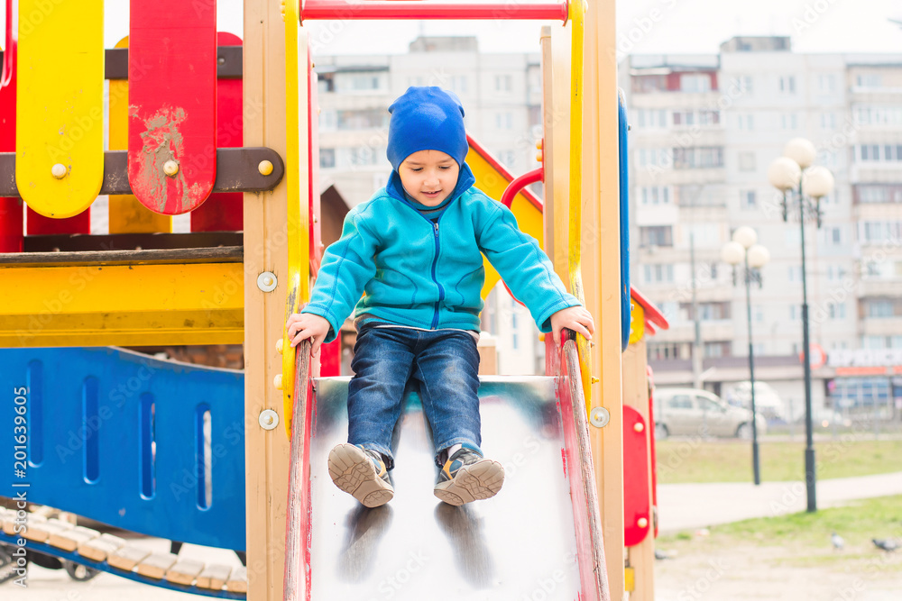 boy plays on the hill