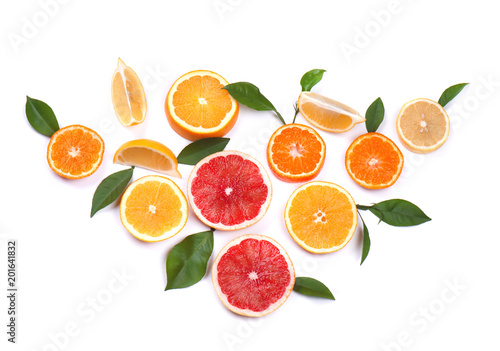 Citrus fruits isolated on white background. Isolated citrus fruits. Pieces of lemon  pink grapefruit and orange isolated on white background  with clipping path. Top view.