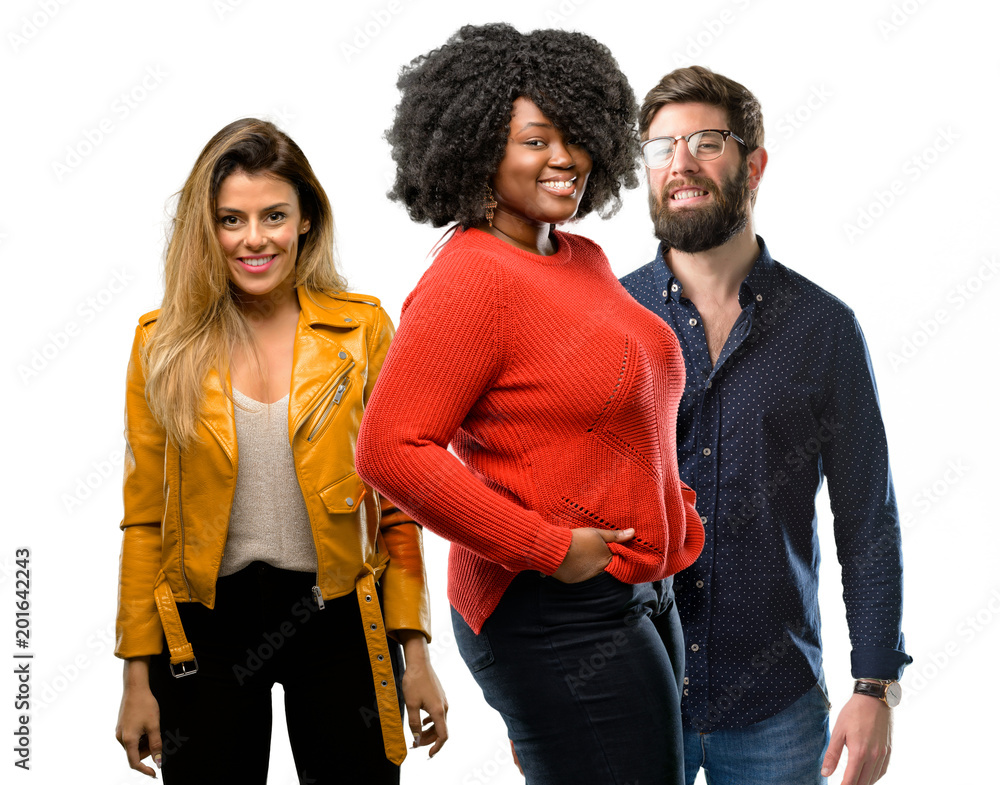 Group of three young men and women confident and happy with a big natural smile laughing Group of three young men and women confident and happy with a big natural smile laughing