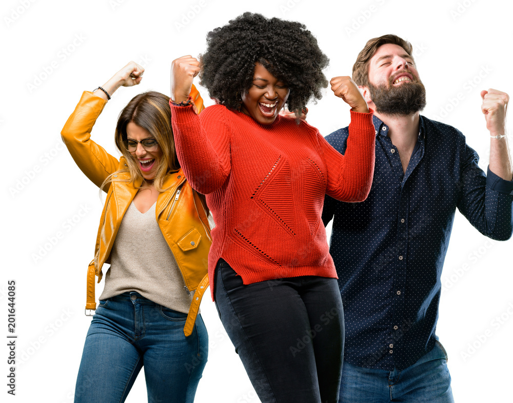 Group of three young men and women happy and excited expressing winning gesture. Successful and celebrating victory, triumphant Group of three young men and women happy and excited expressing winning gesture. Successful and celebrating victory, triumphant