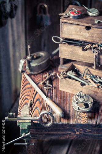 Vintage locksmiths table full of keys and locks