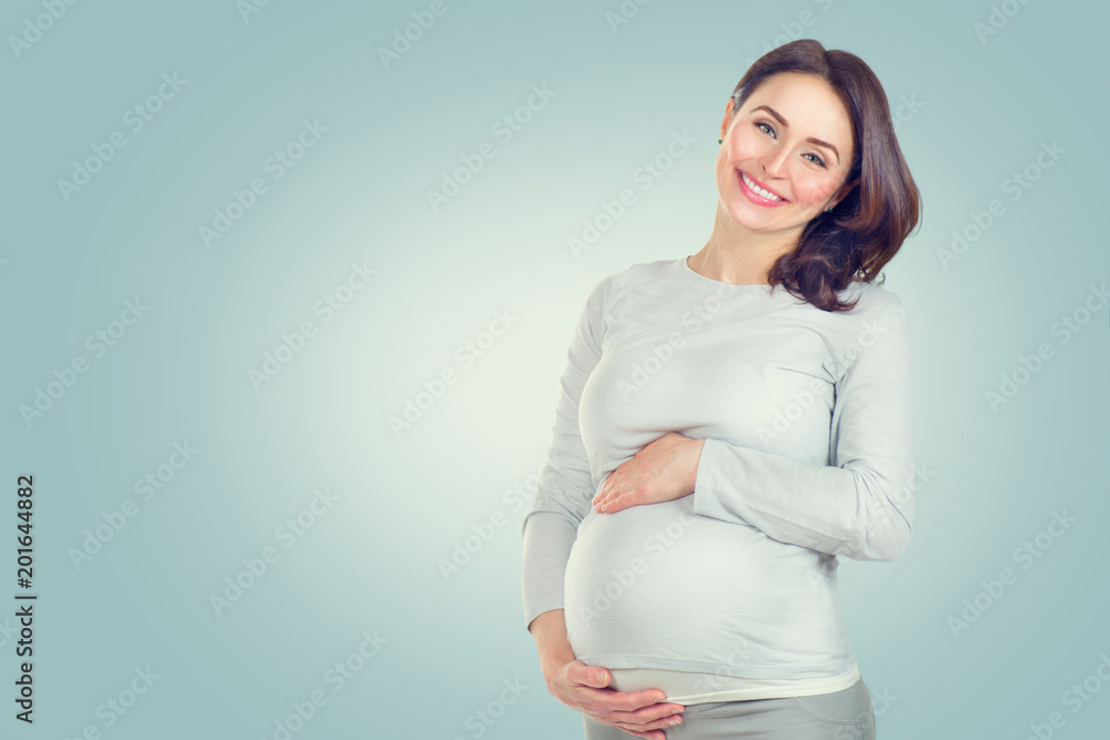 Pregnant happy woman touching her belly. Pregnant middle aged woman portrait. Healthy pregnancy concept Pregnant happy woman touching her belly. Pregnant middle aged woman portrait. Healthy pregnancy concept
