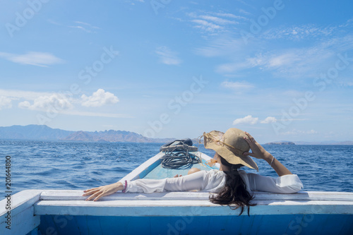Young female tourist looking at beautiful seascape