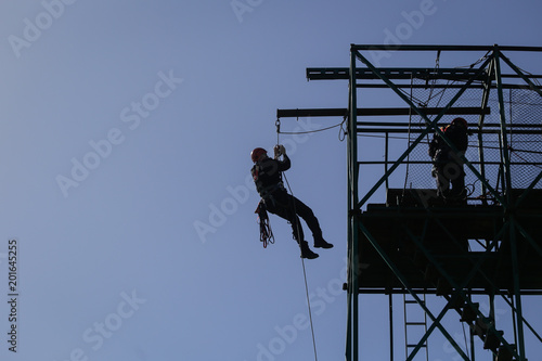 BUCHAREST, ROMANIA - APRIL 21: Firefighters are rappelling and climbing ropes at a drill exercise, on April 21, 2017, in Bucharest