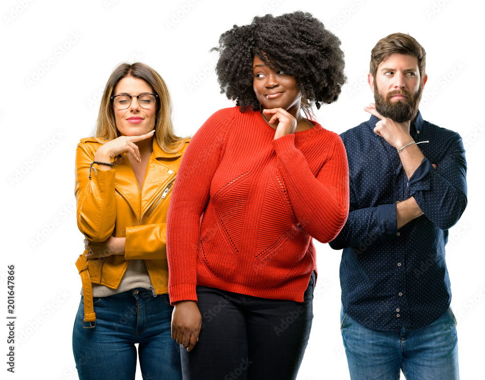 Group of three young men and women thinking thoughtful with smart face, expressing question and doubt. Imagine the solution Group of three young men and women thinking thoughtful with smart face, expressing question and doubt. Imagine the solution